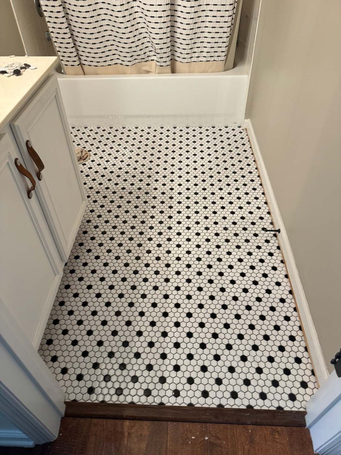 Black and white hexagon mosaic bathroom floor