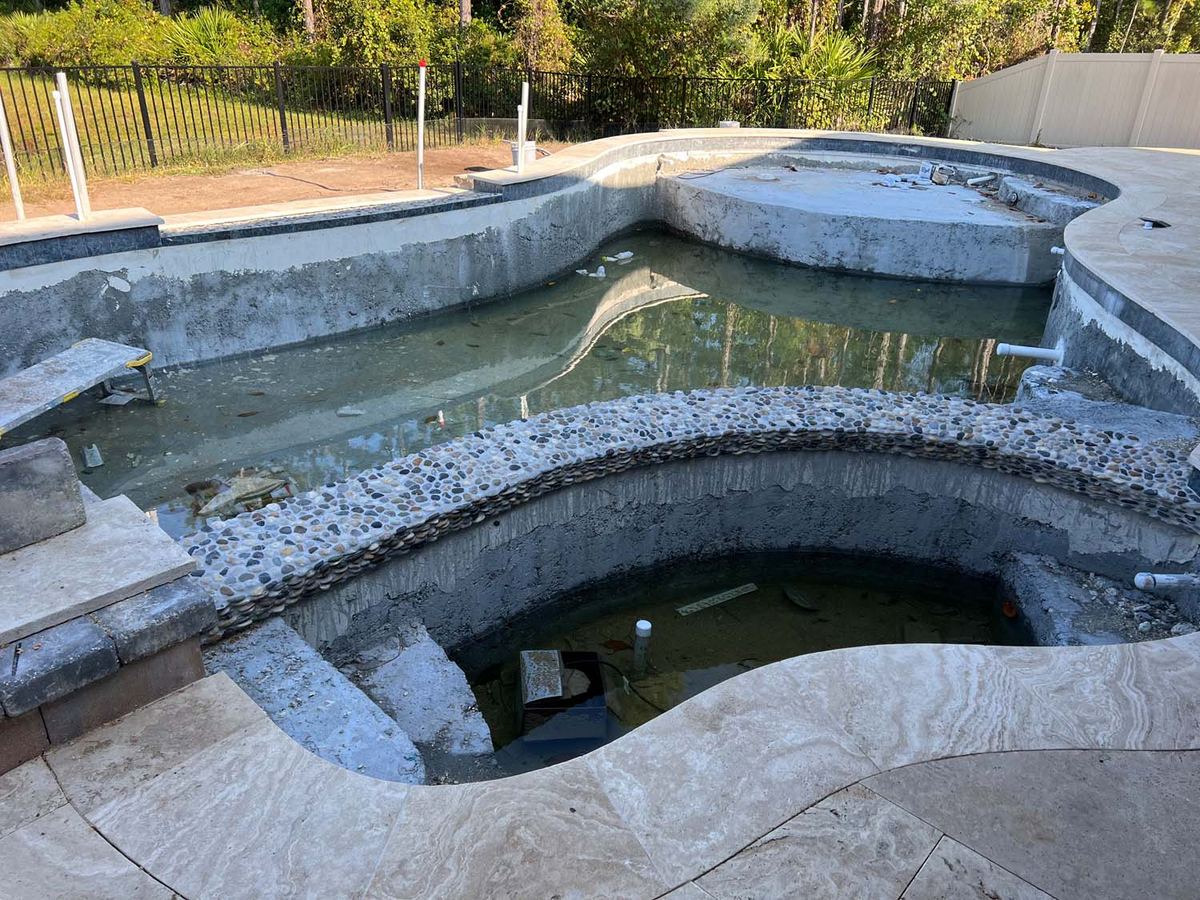 Natural stone coping going onto a pool and spa