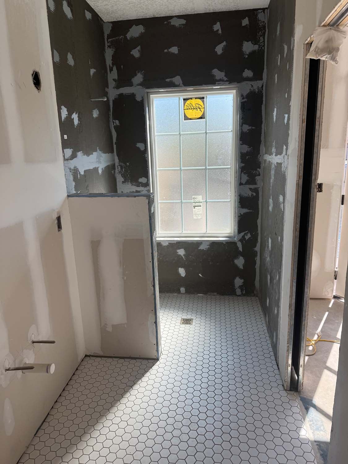 Shower walls sealed with waterproofing membrane before the tile goes on