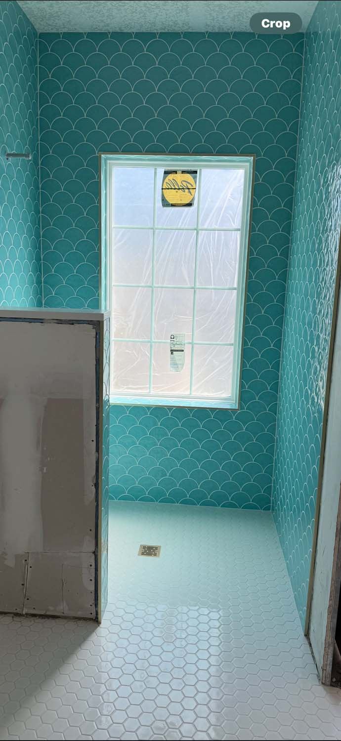 Turquoise arabesque tile shower