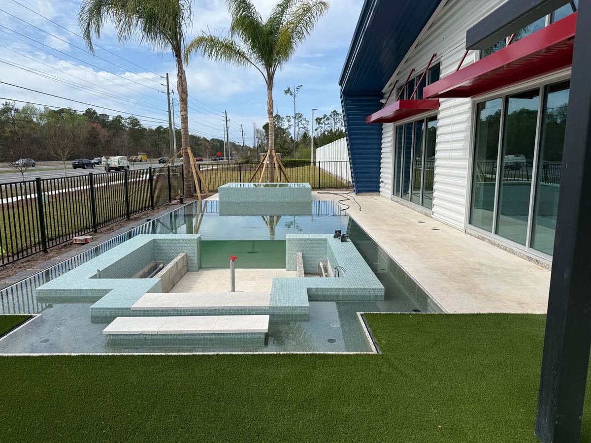 Pool and fire feature tiled at a commercial property