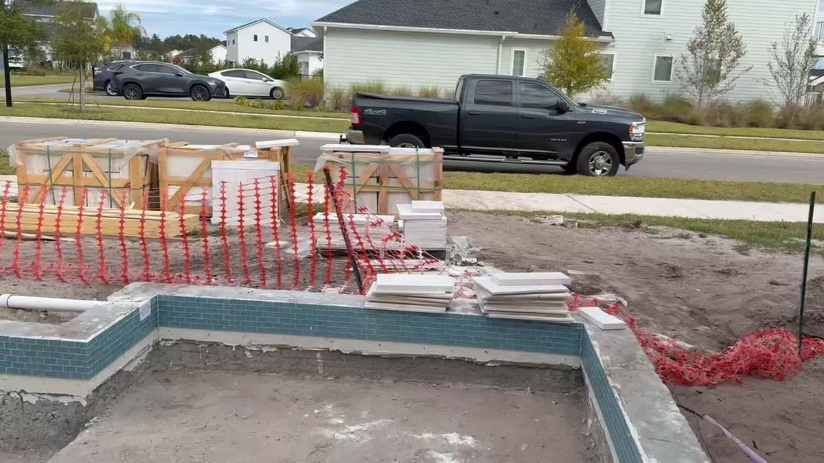Coping and waterline tile going onto a new pool