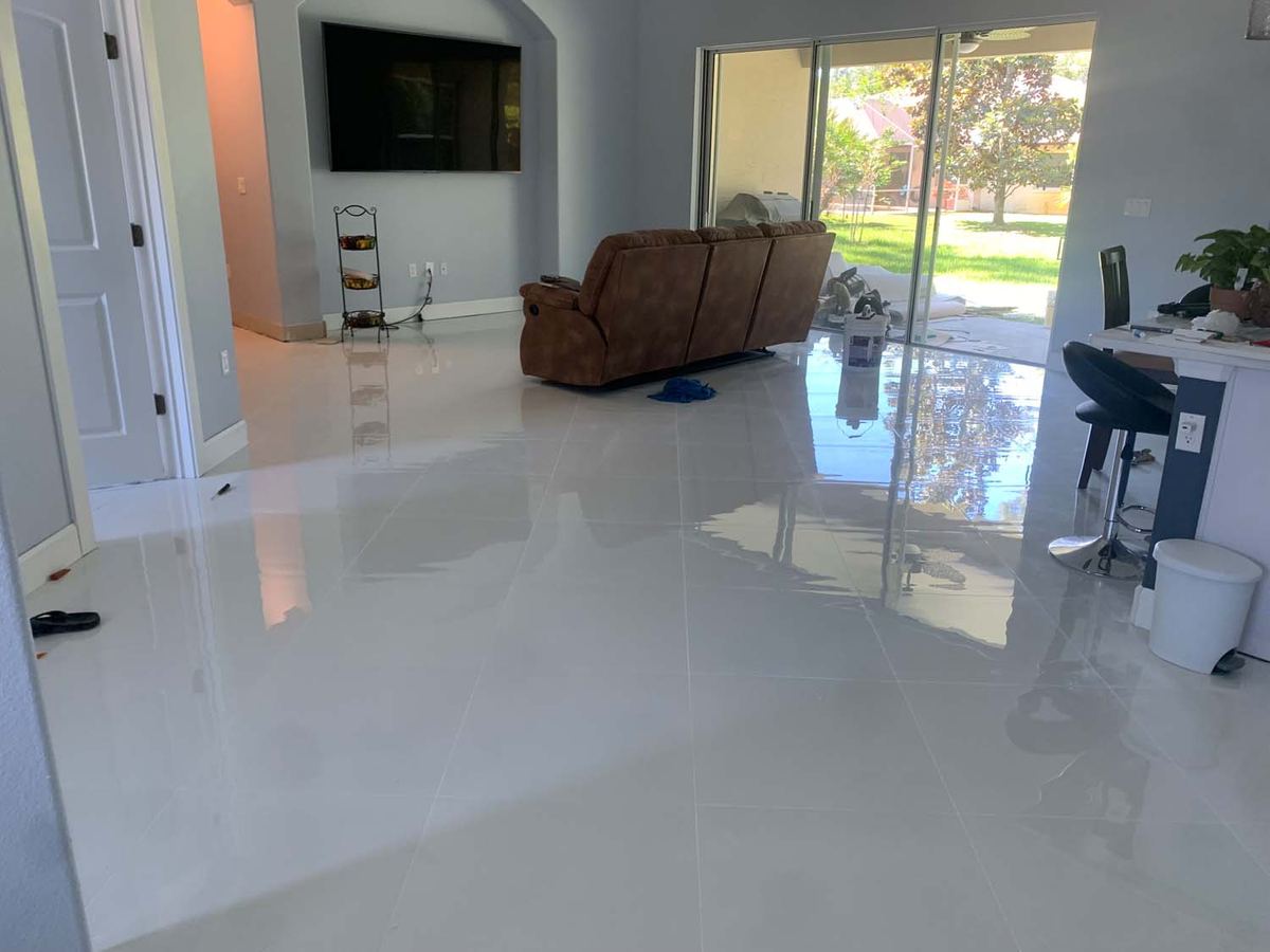 Polished large-format porcelain in an open living room